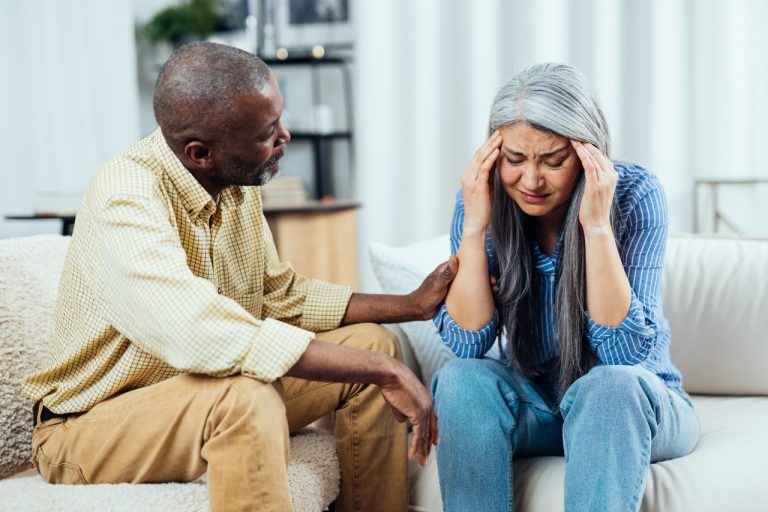 cinematic image of a multiethnic senior couple.